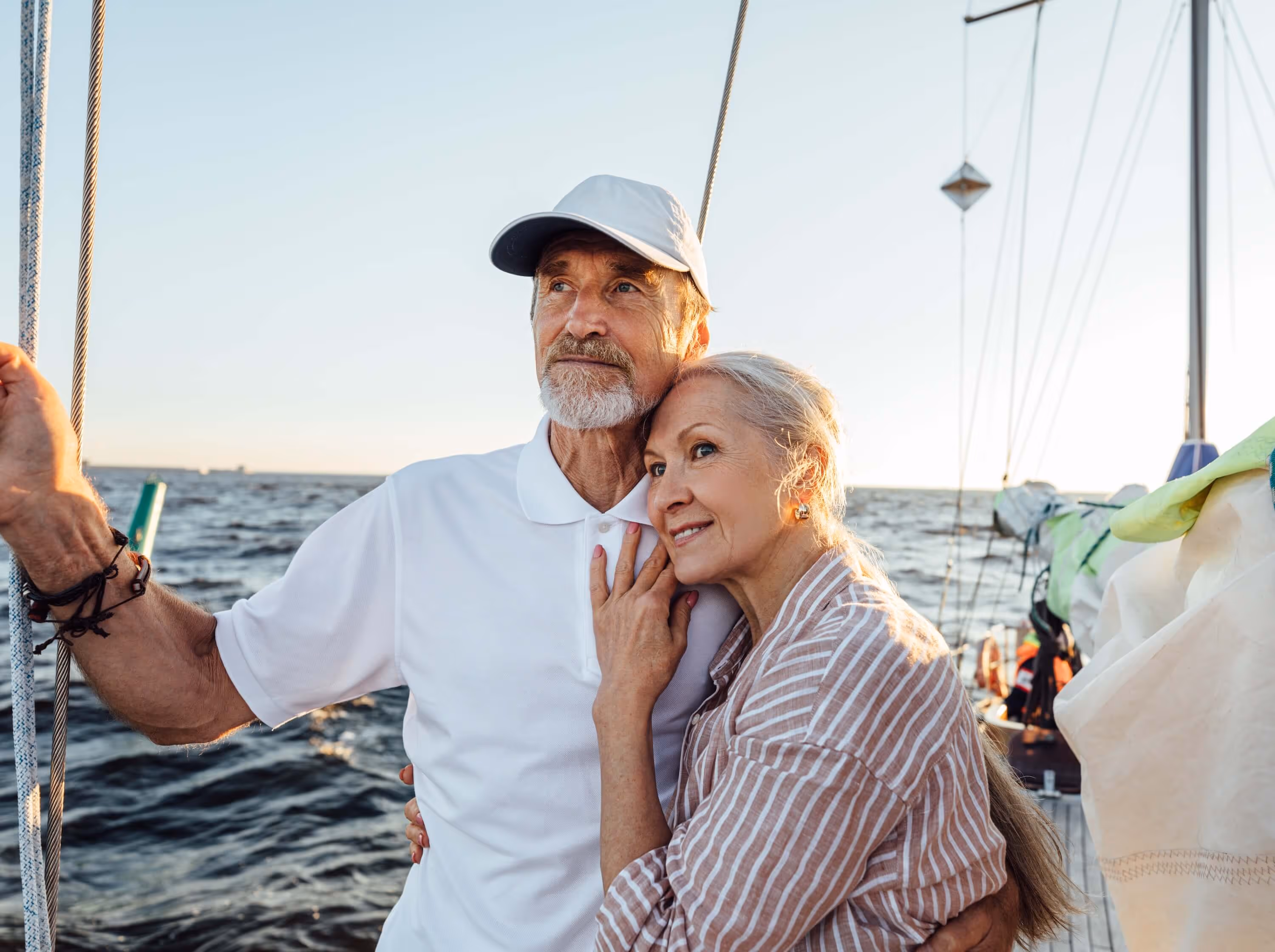 A man and a woman standing on a boat.