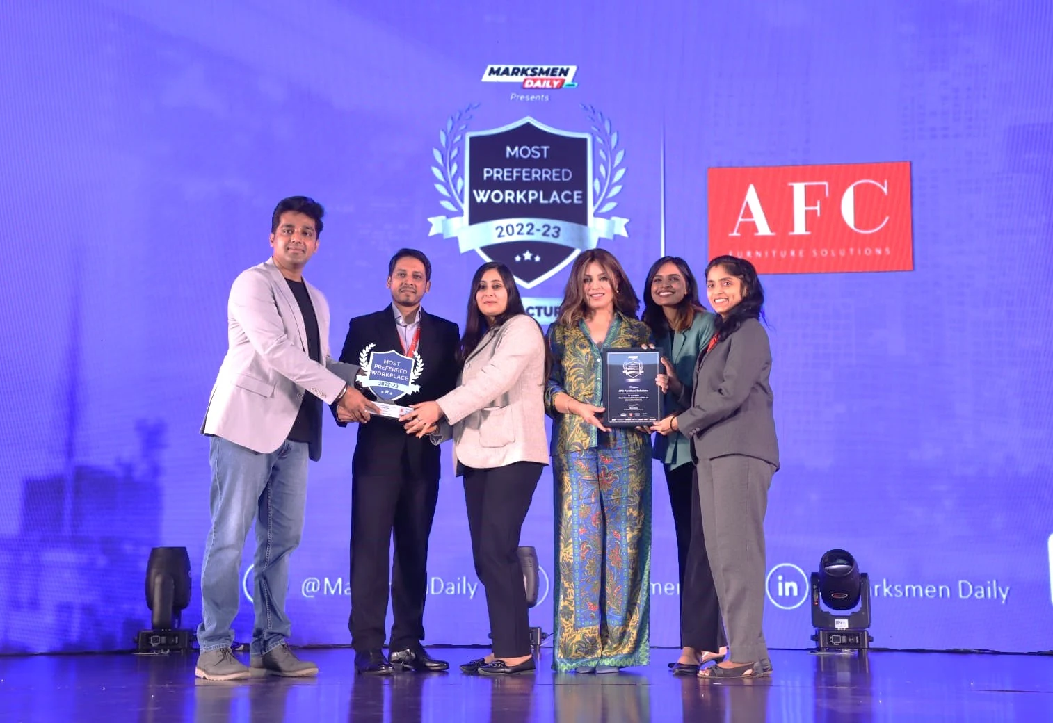AFC Furniture Solutions team receiving an award