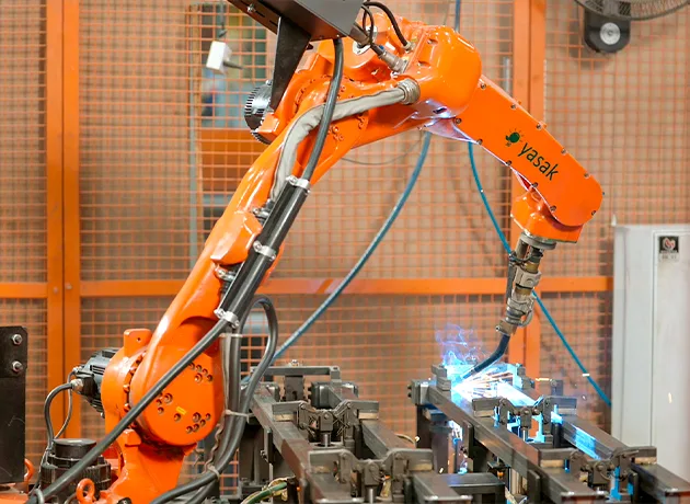 Robotic arm performing precision furniture manufacturing