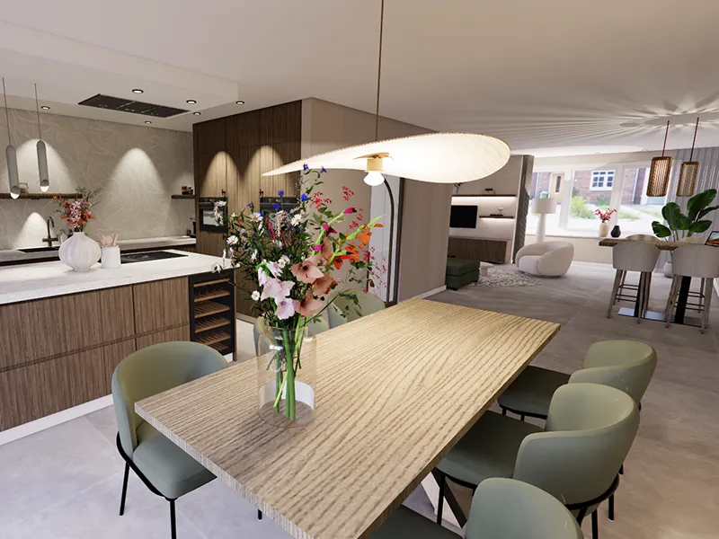 Stijlvolle open keuken en eetruimte met houten accenten, lichte eettafel, groene stoelen en een grote vaas met bloemen.