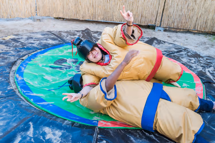 Alvin, Regional Manager Greater China & Japan, tackling Abhi, Regional Manager APAC, at our Summer Party