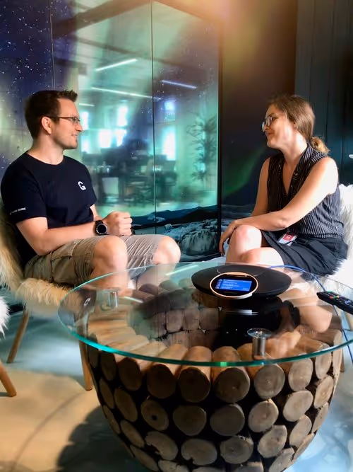 Rico meeting with Heidi Corpela, Workforce Manager, in our Northern Lights-themed meeting room