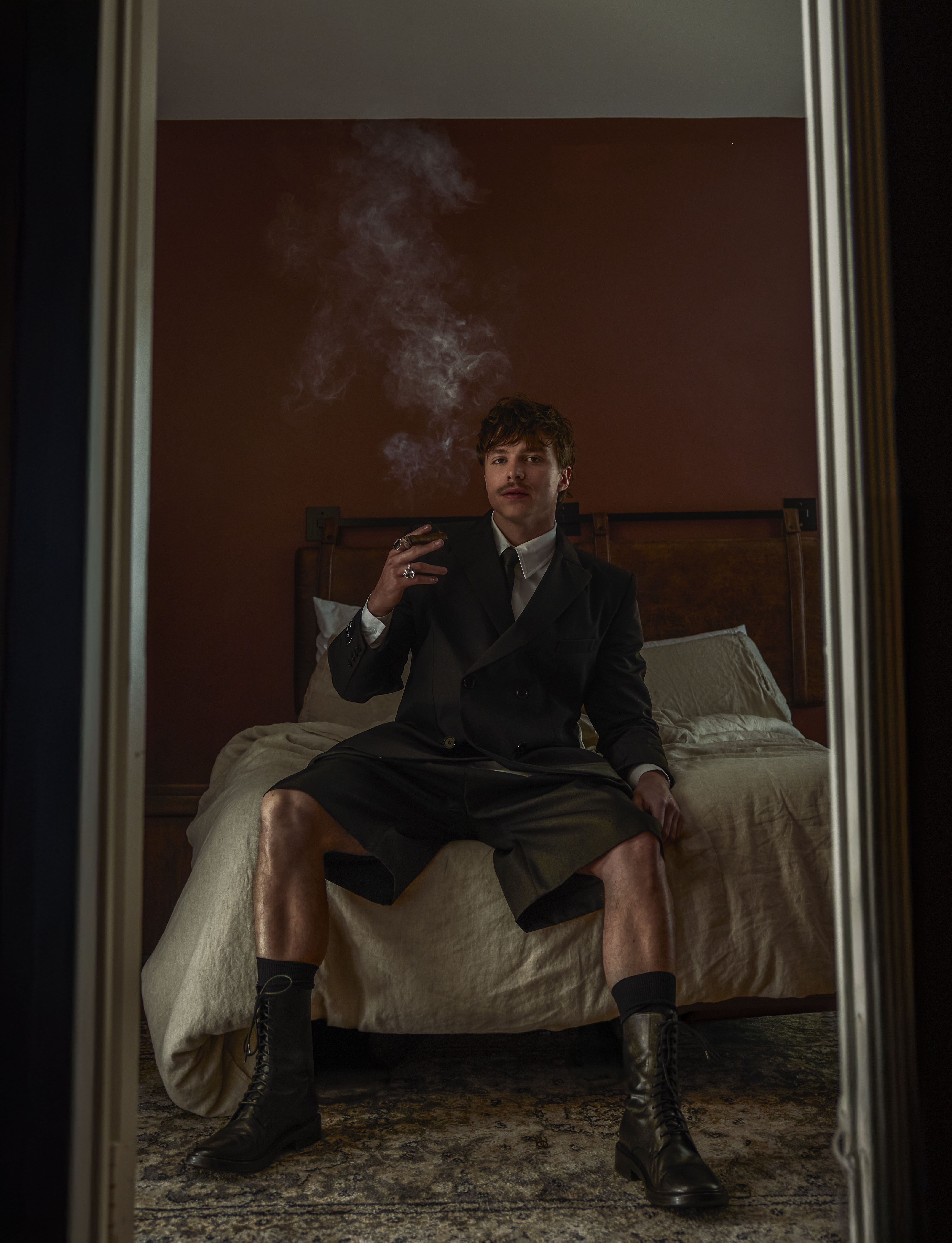 Nicholas Alexander Chavez in Galore editorial, smoking in hotel room