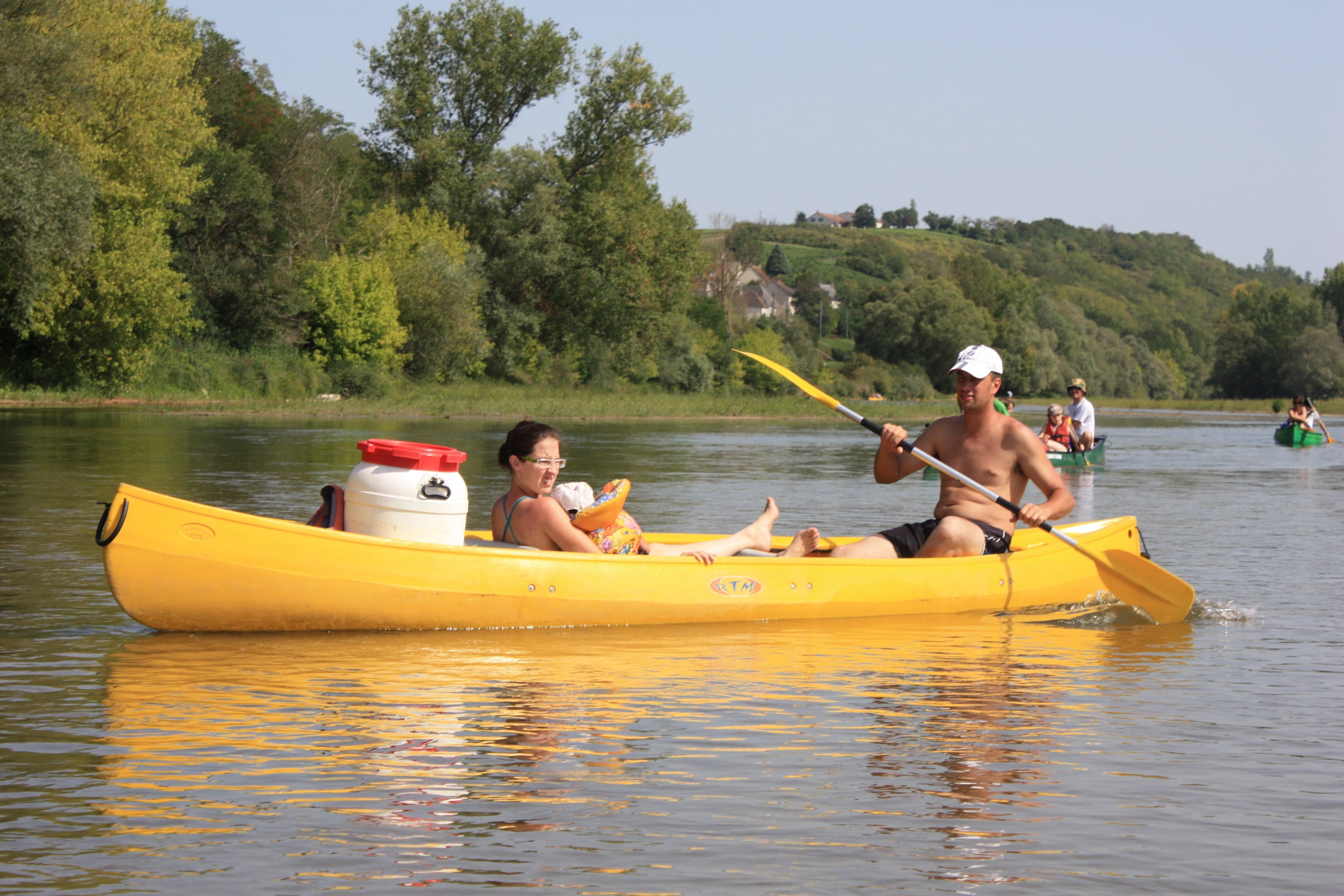Side view of cuple on a Kayak