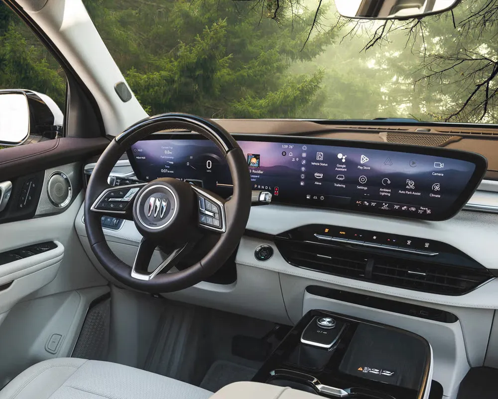 The infotainment system in a Buick with trees showing in the background