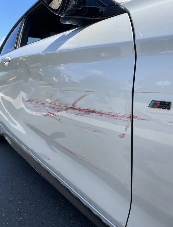 Seitenschaden an einem BMW, vom Kunden per WhatsApp geschickt