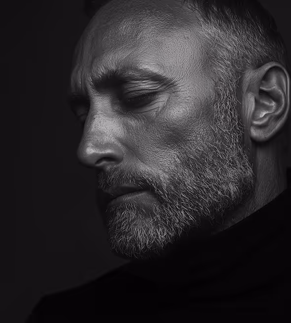 Black and white image of a man with a short beard