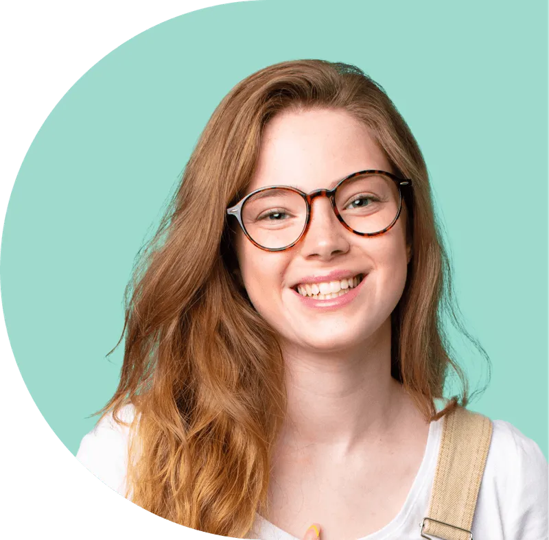 A woman wearing glasses and smiling for the camera.
