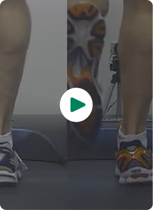 Video thumbnail showing a person's legs using a step-up platform or exercise equipment in what appears to be a gym or fitness setting. The person is wearing athletic shoes and the image has a play button overlay indicating this is a fitness or exercise demonstration video.