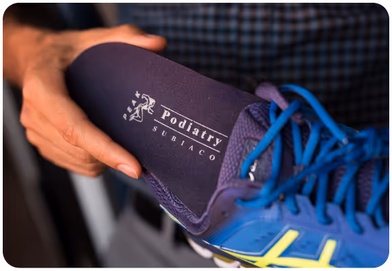 A worker that puts orthotic in the shoe