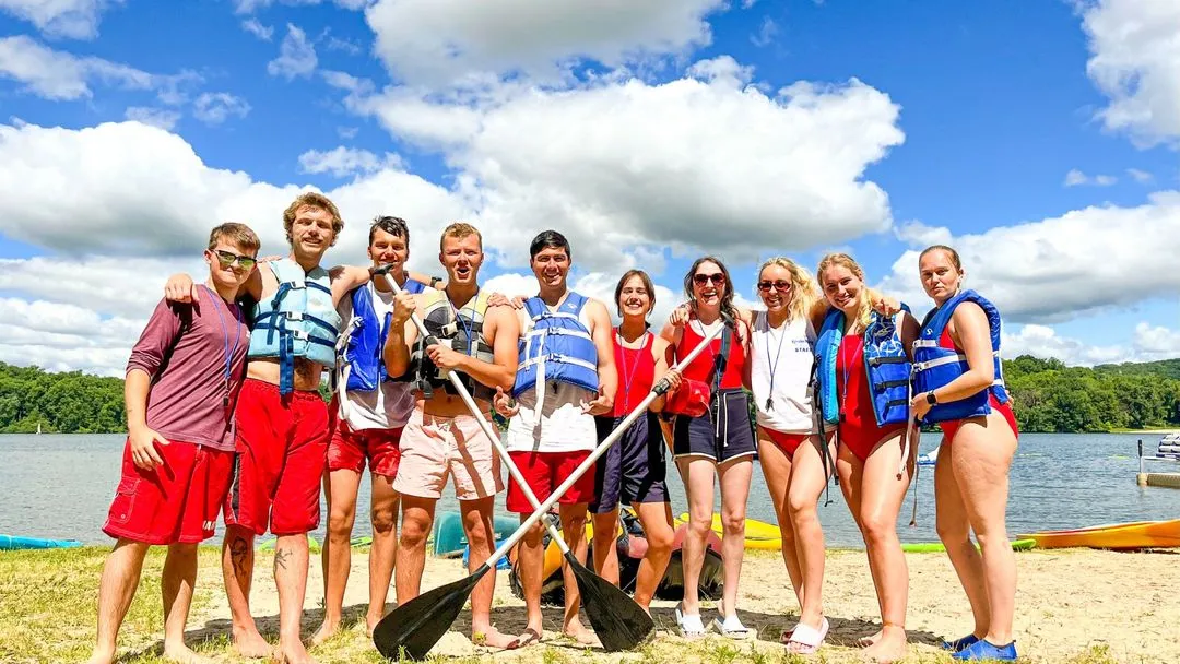 Students socializing after canoe activity at AmeriCamp AU summer camp in USA for Australians.