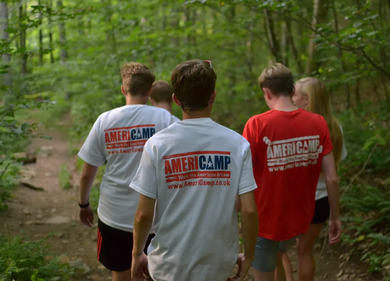 Americamp participants enjoying an outdoor nature hike at summer camp in the USA.