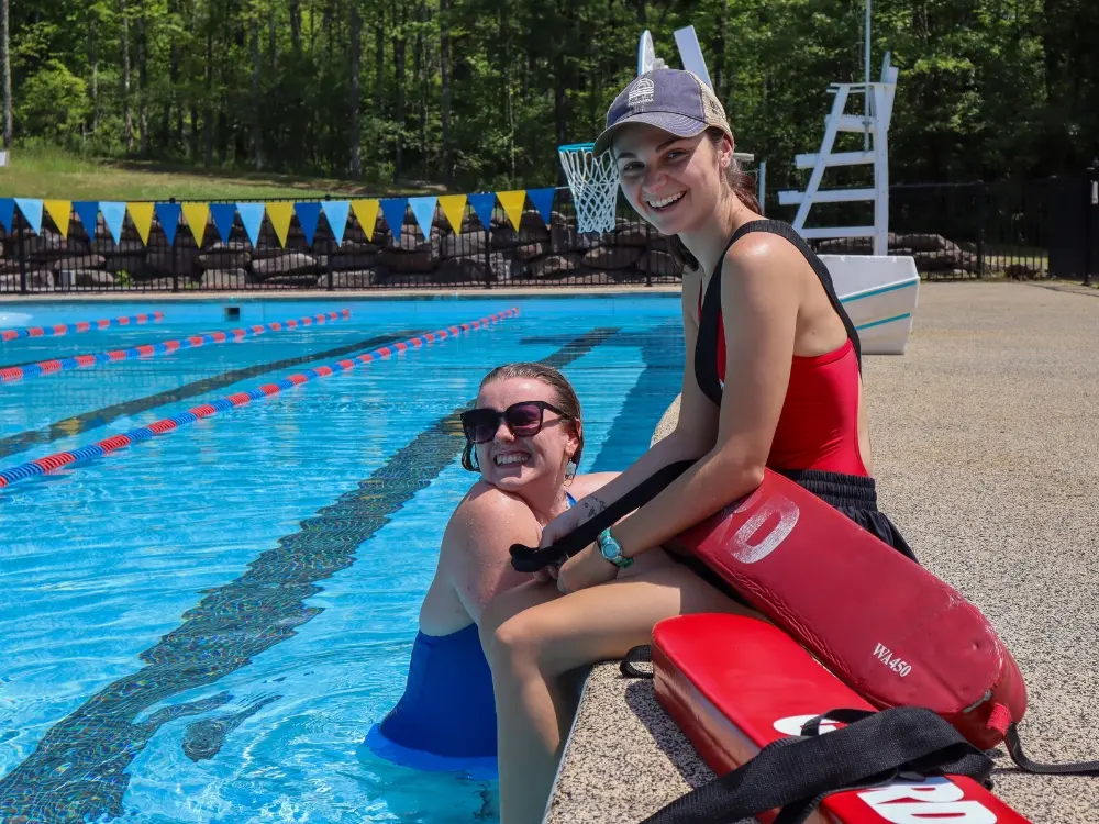 Like guard camp counselor by the pool at AmeriCamp AU summer camp in USA.