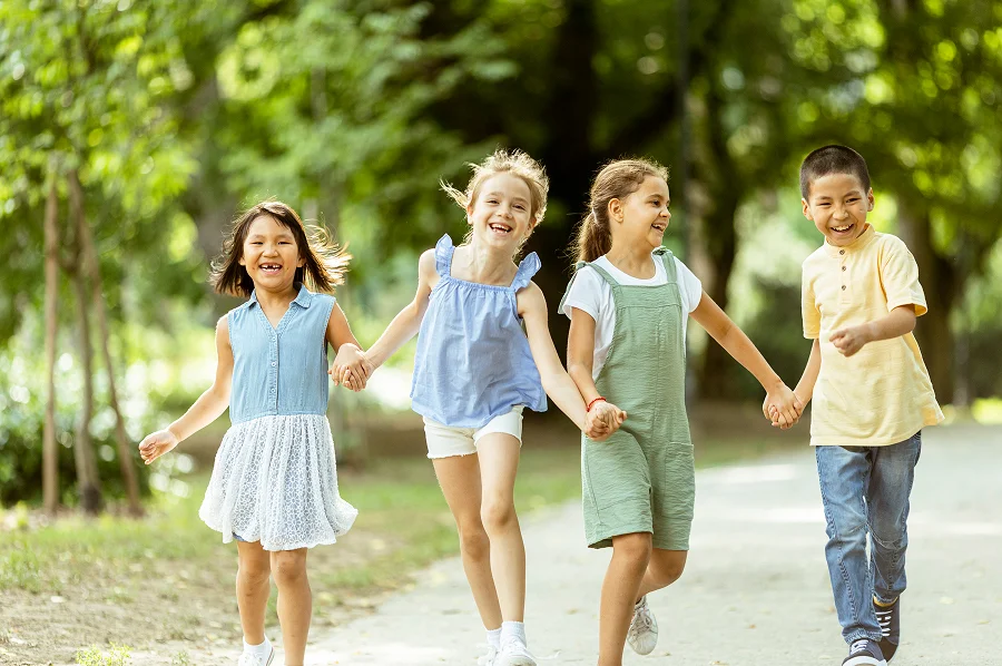 group of asian and caucasian kids having fun
