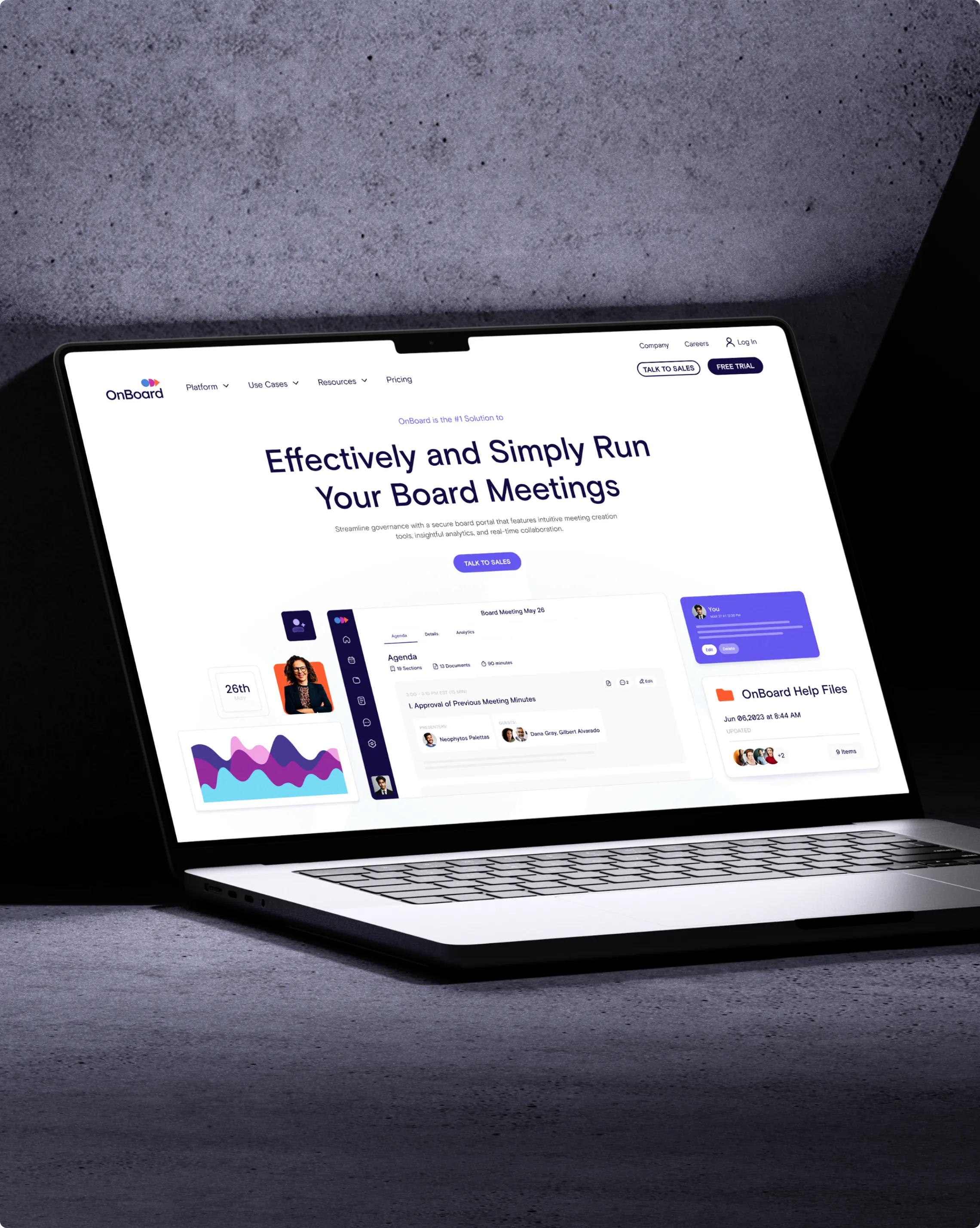 Laptop screen showing the home page of the OnBoard Meetings website