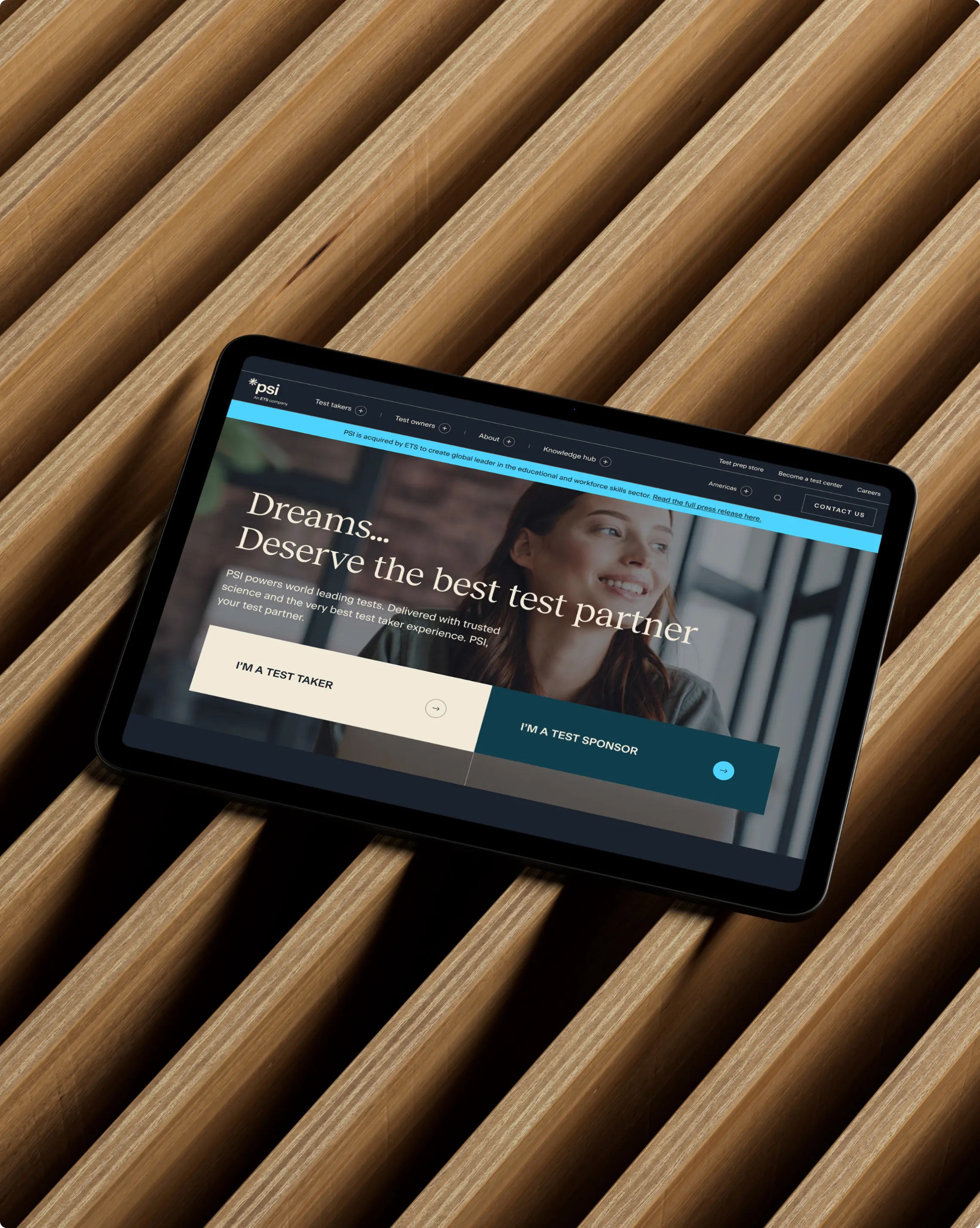 Tablet screen showing the home hero section of the PSI Exams website
