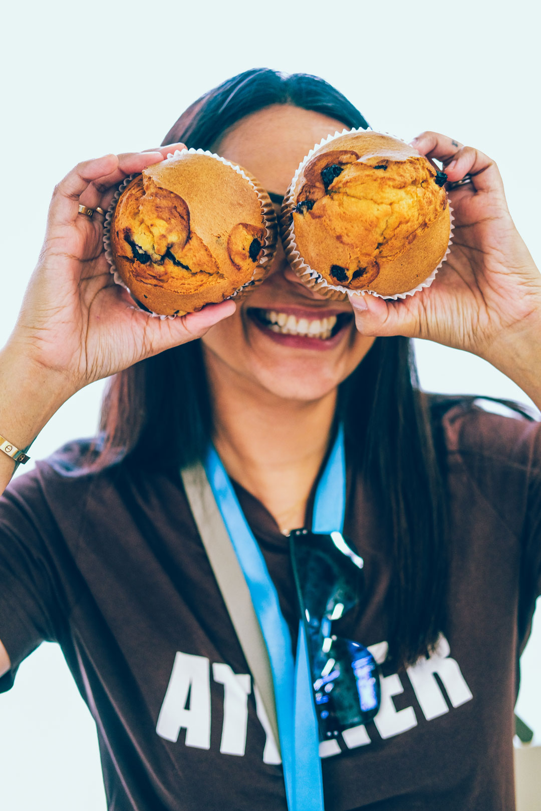 An audience at an event clapping and cheering enthusiastically. The crowd looks engaged, with some people laughing and smiling while applauding.