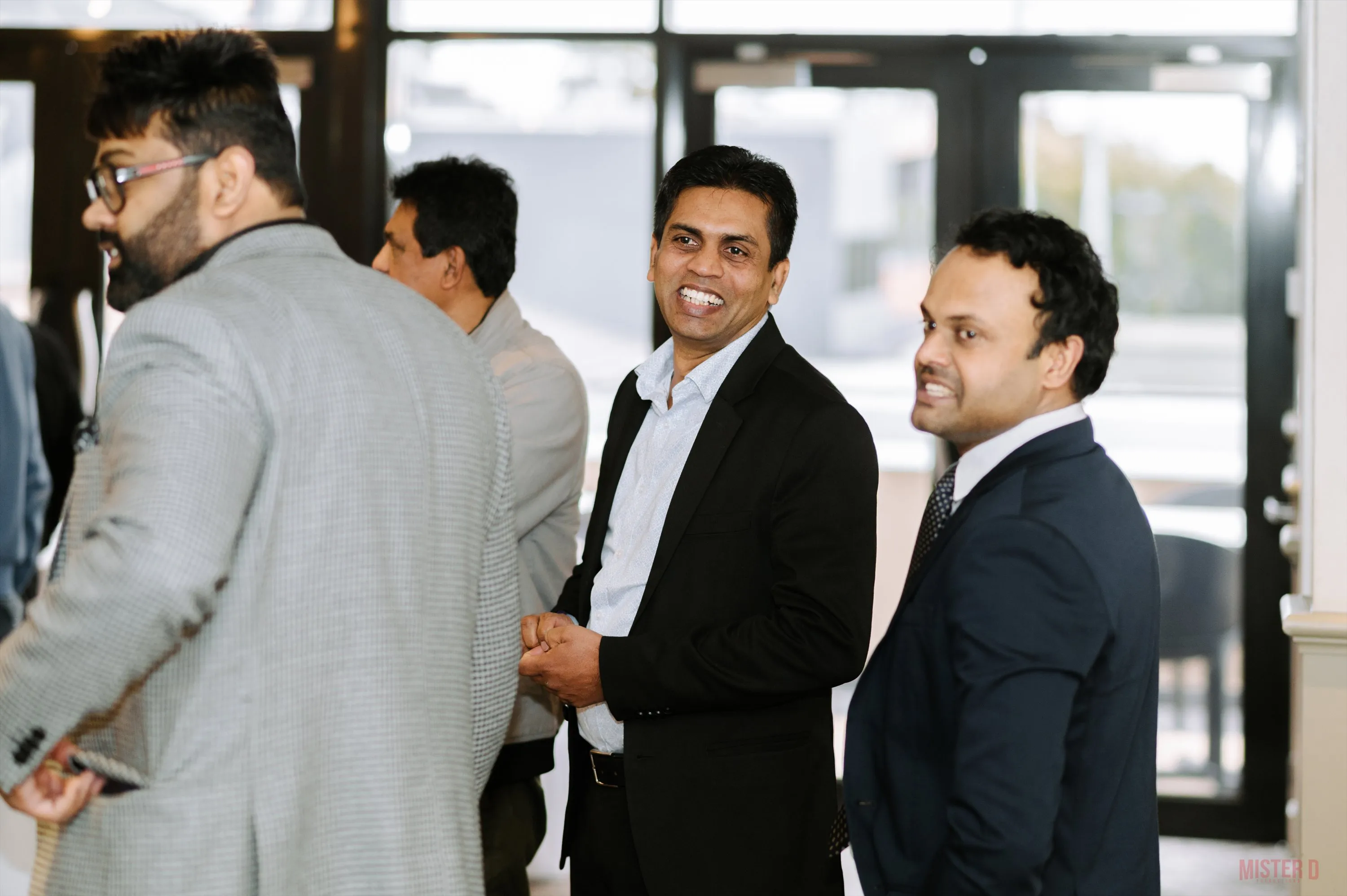 Attendees sharing a handshake during a conversation at SALA CPD Day 2025