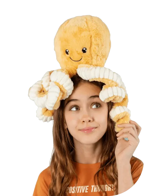 child with toy on the head