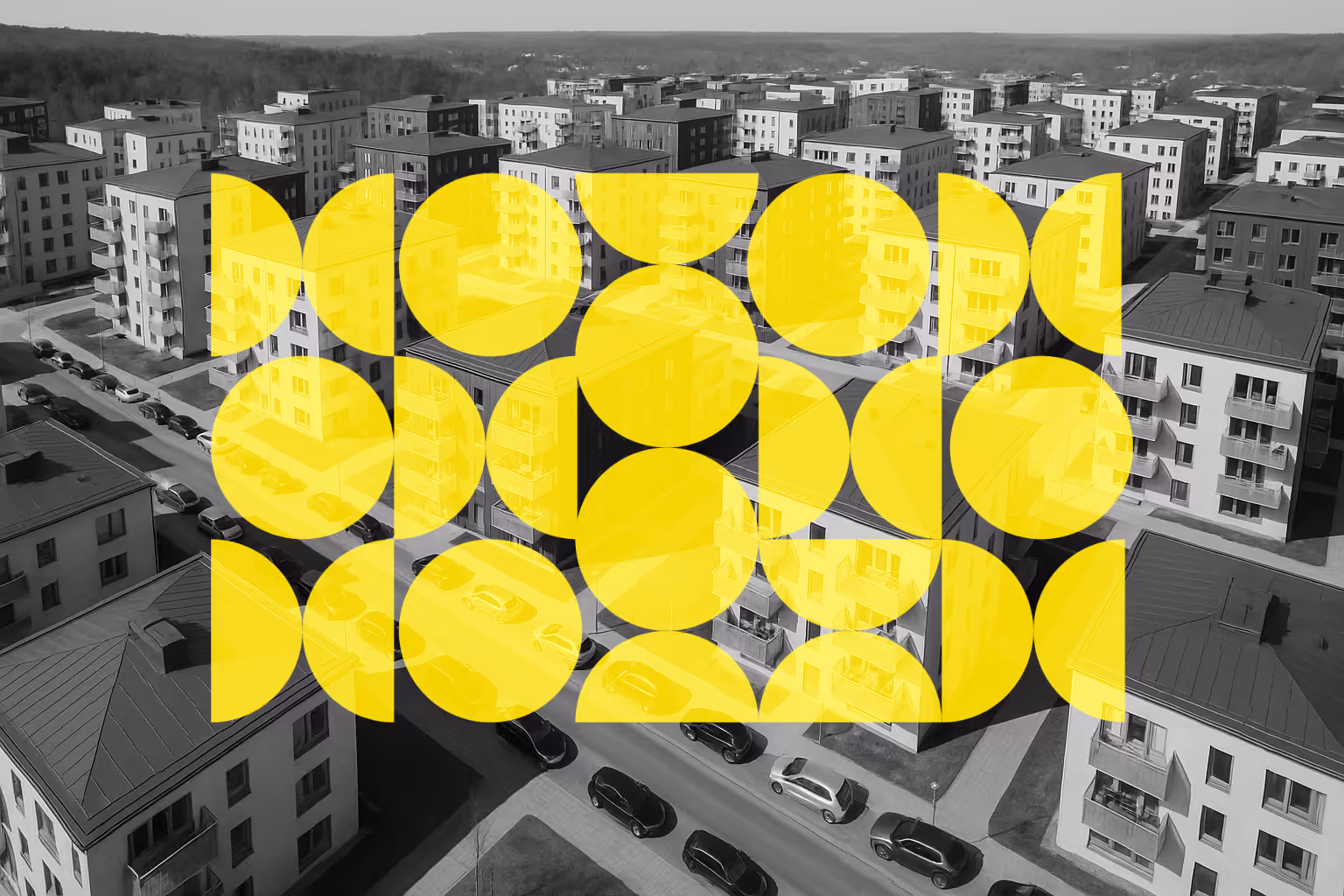 Bostadskomplex i svartvitt, med geografiska former lagda ovanpå