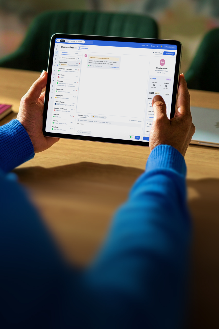 Hotel staff member using Amenitiz Conversations on a tablet