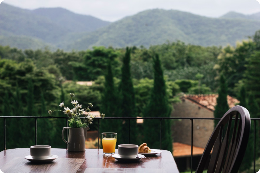 View from an independent hotel terrace in Europe, with breakfast served.