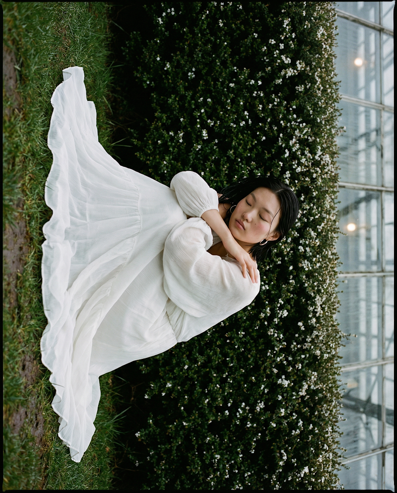 Fashion editorial white dress in garden