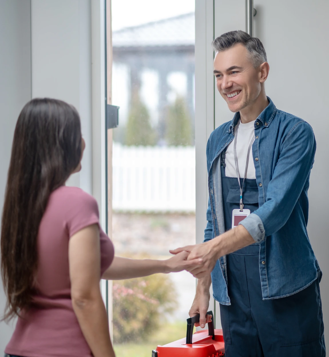 Happy Client Shaking a Heating Engineer's Hand