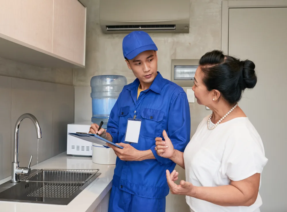 Plumber Preparing a Quote for a Client