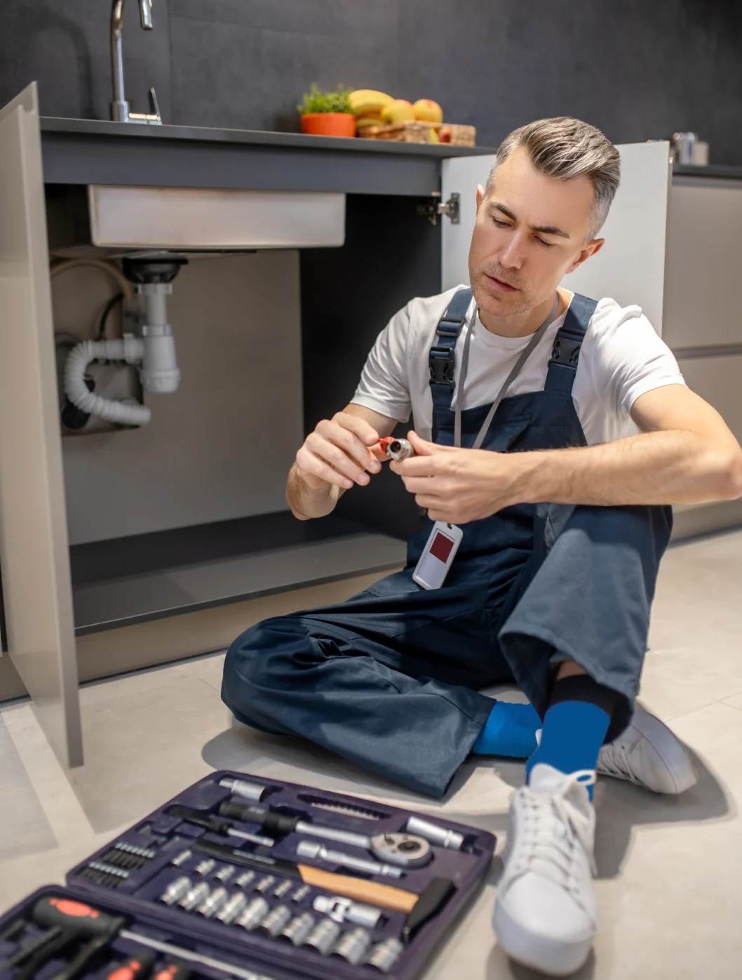 Plumber Working on a Sink