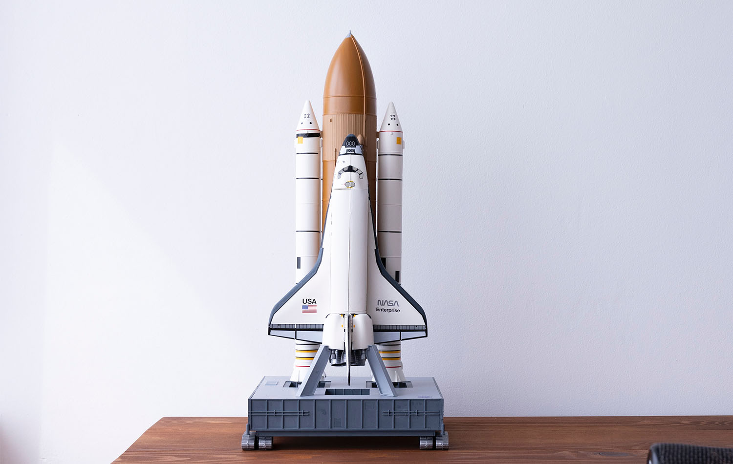 A small model rocket on a desk