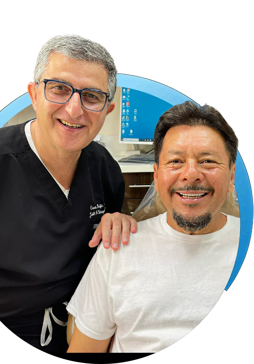 Dr. Jalil and a patient smiling together at Ocean Pacific Dental
