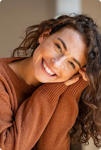 Beautiful young woman smiling with beautiful teeth showing