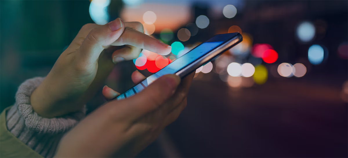 woman making mobile transaction on her phone