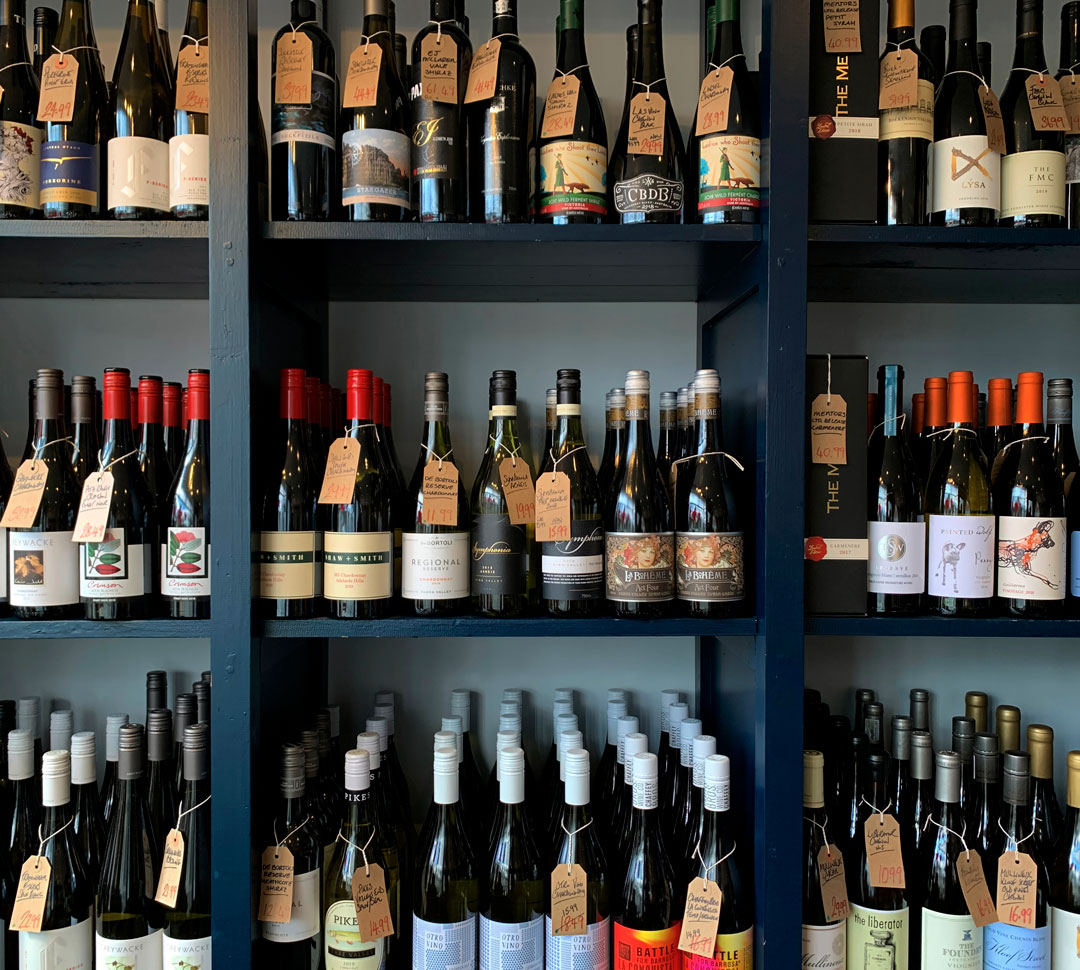 Rows of wine bottles on a retailer's shelves
