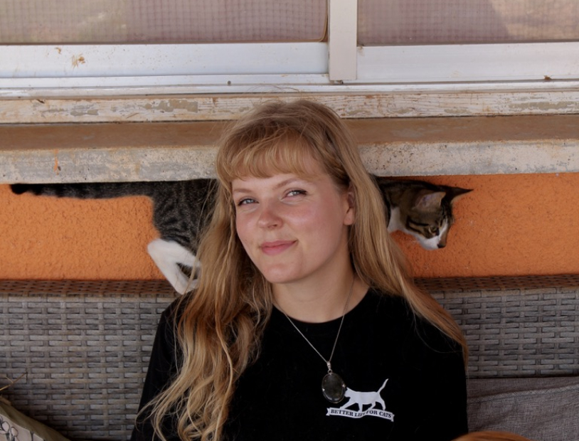 Milli, cat mommy at Back to Earth, sitting with cats at the Better Life for Cats shelter