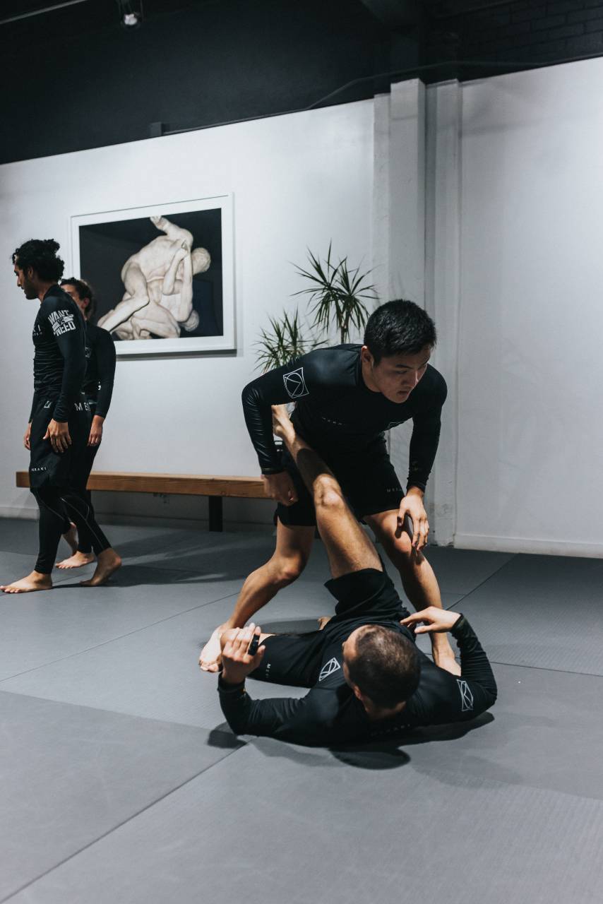 Guys training Jiu Jitsu
