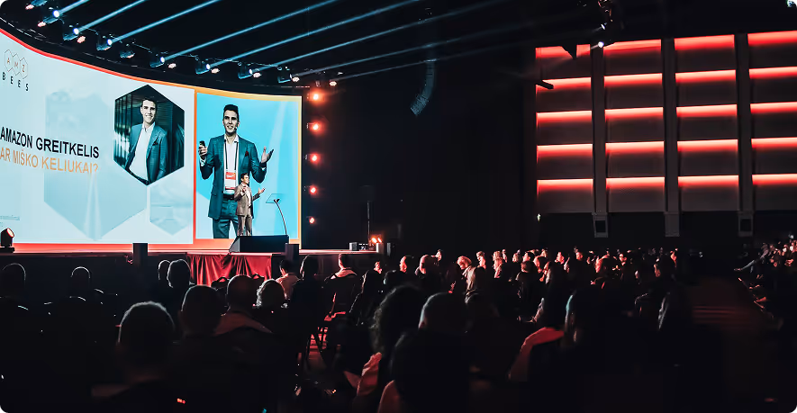 Klaidas speaking at an event