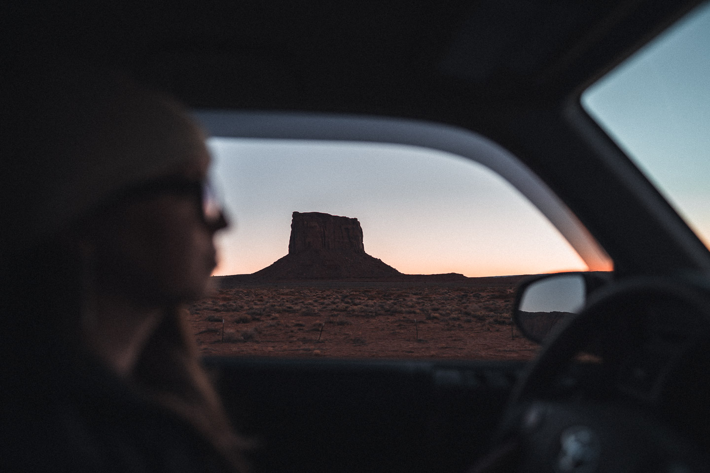 Woman driving in Monument Valley