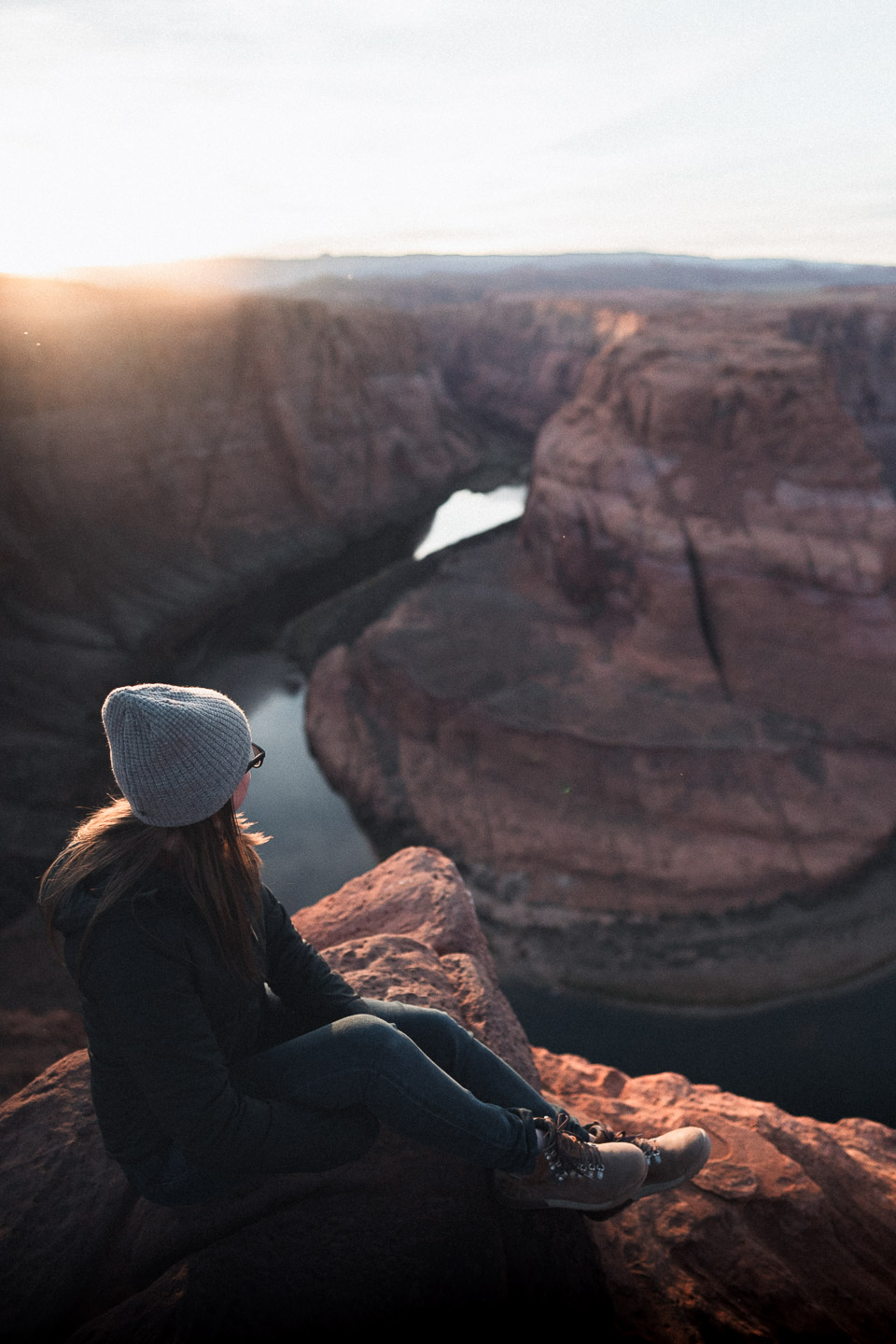 Woman sitting near Horseshoe Bend
