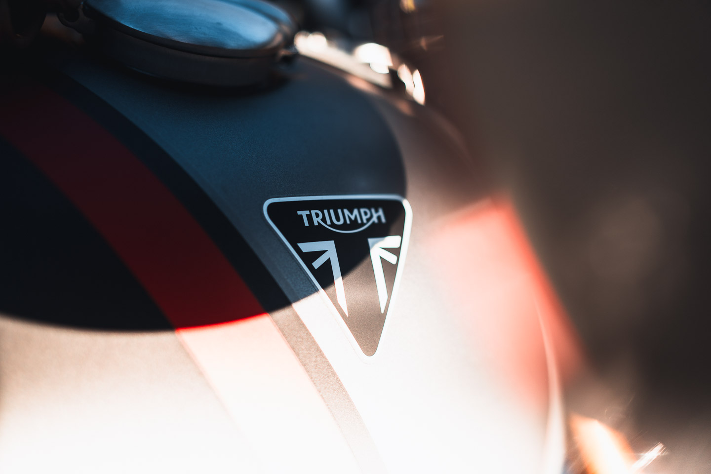 Close up of Triumph Motorcycle gas tank and logo