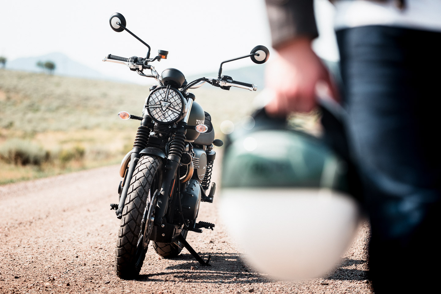 Triumph motorcycle with helmet in foreground