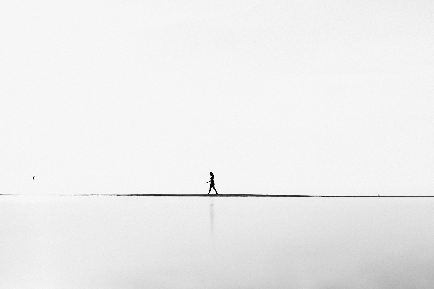 Woman walking on Cape Cod beach