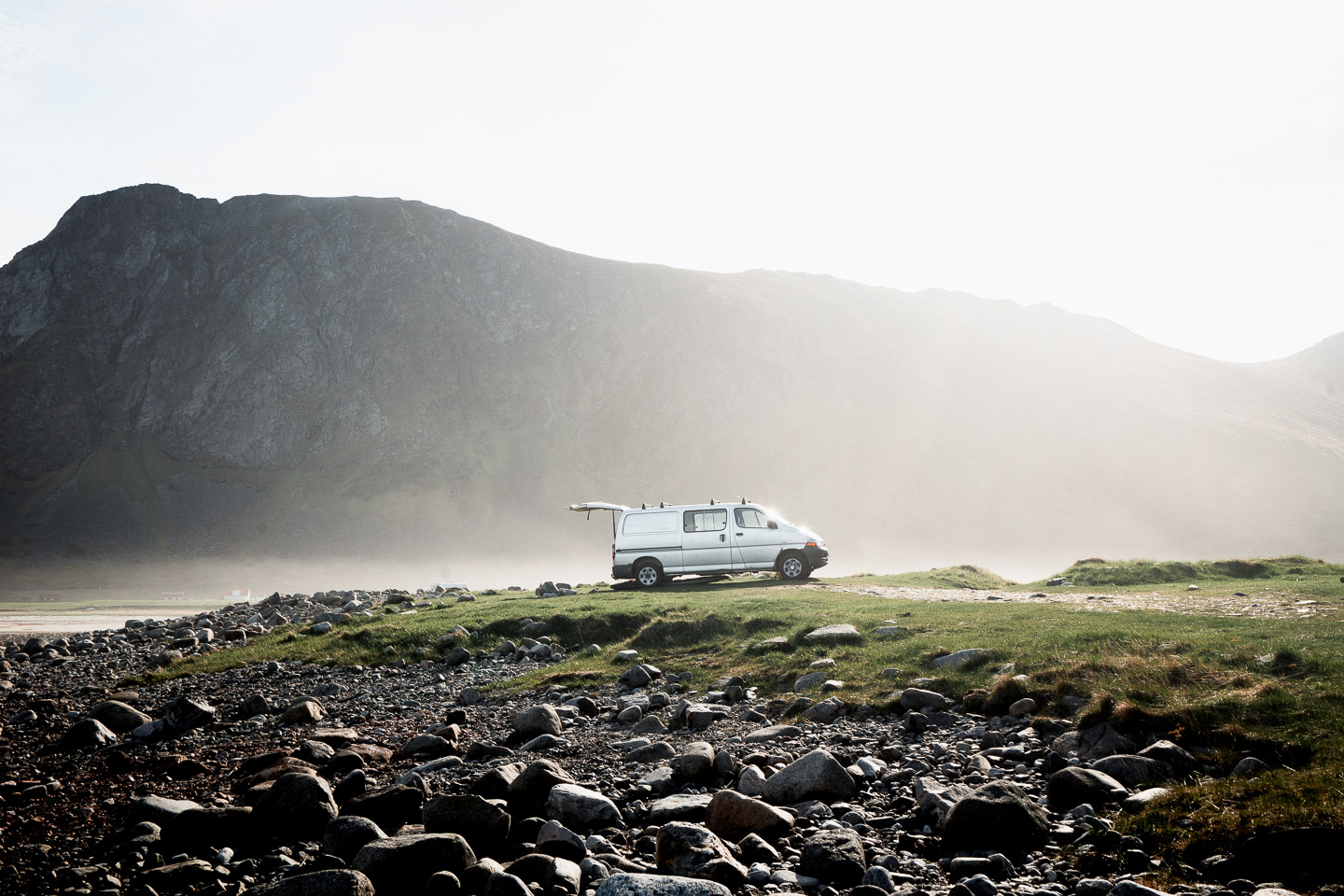 A van at sunrise by the sea in Norway