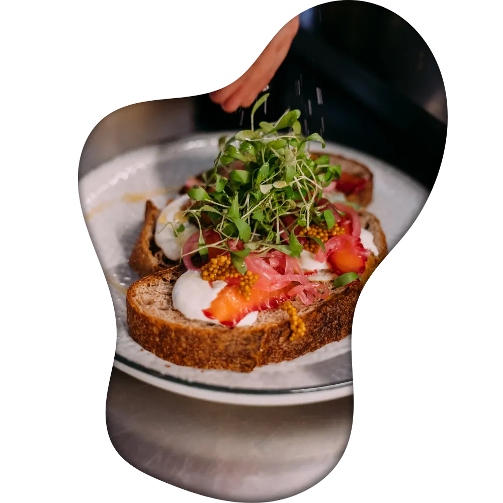 A dish with toast being prepared in the kitchen