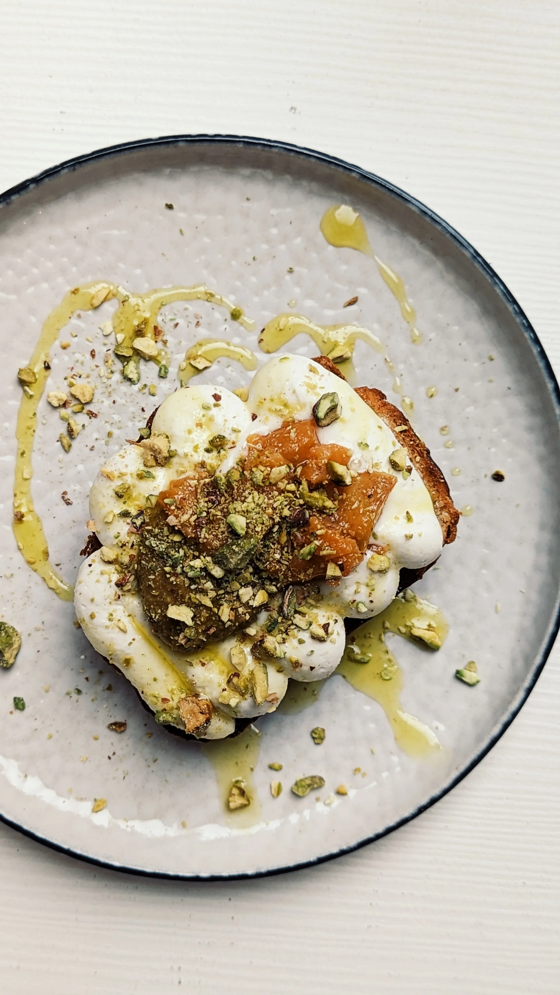 A seasonal dish with cheese, toast, oil and many other delicious ingredients