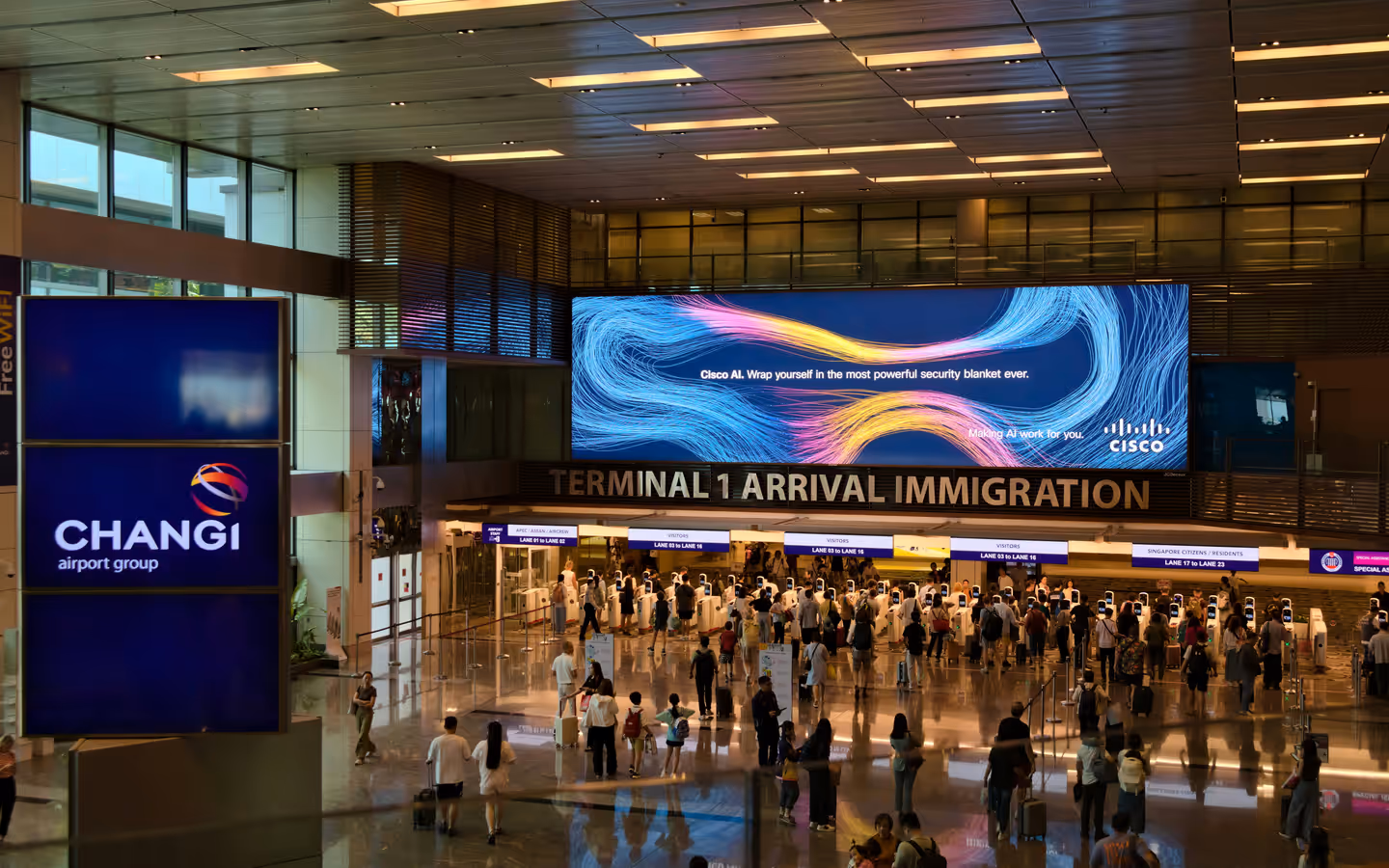 A group of people walking through an airport