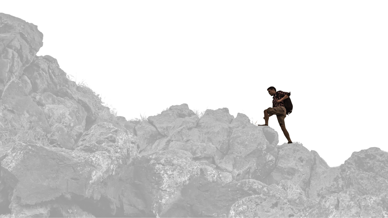 Individual walking up a steep incline