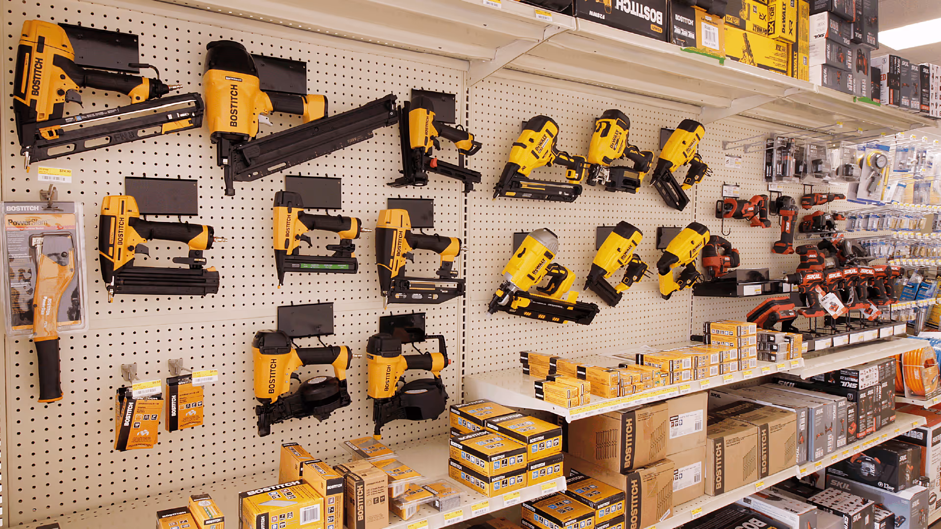 A photo of a shelf in a retail store that includes power tools and hardware.