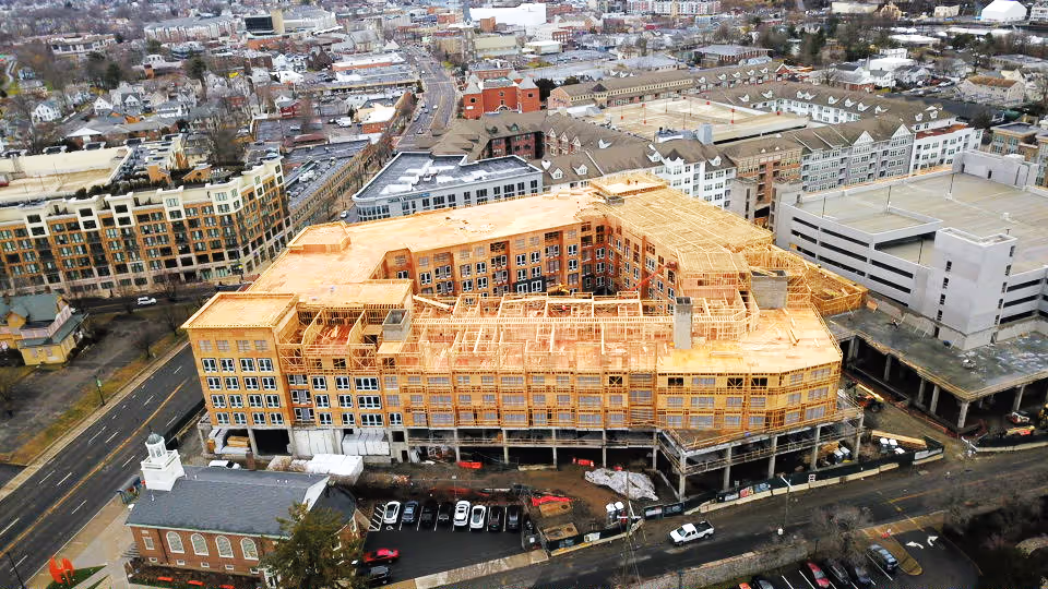 A photo of a large-scale multi-unit housing development under construction.